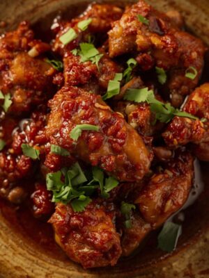 CHICKEN CHILLI dry dish serv in plate CHICKEN CHILLI